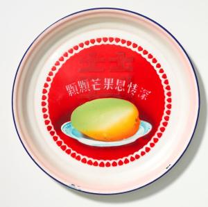 Tray with design of mango, character for “Double Happiness,” and stenciled slogan:  “With each mango, profound kindness,” 